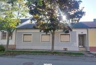 Solides Einfamilienhaus mit Garten und großer Halle