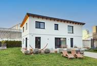 Energieeffizientes Einfamilienhaus mit großem Garten in zentraler Lage