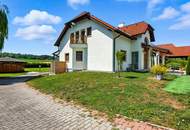 High-end living in a peaceful green location! A feel-good retreat in a class of its own: tradition meets state-of-the-art comfort!