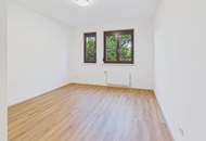 Moderne Erdgeschosswohnung mit Garten, Garage und Blick ins Grüne