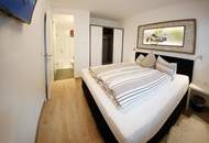 Neuwertige 4-Zimmer-Premiumwohnung möbliert mit 2 Bädern, Eigengarten & 2 Stellplätzen.