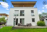 Zuhause im Grünen – Lichtdurchflutete Maisonette mit Gartenoase und Wasserblick