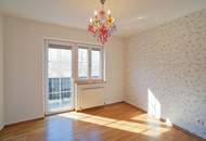 Reizende 3-Zimmer-Wohnung mit 2 Balkonen, gartenseitiger Veranda und Garagenplatz