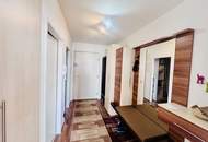 GROßZÜGIGE 5-ZIMMER TERRASSENWOHNUNG MIT 160 m² NUTZFLÄCHE, TIEFGARAGENPLATZ UND FERNBLICK