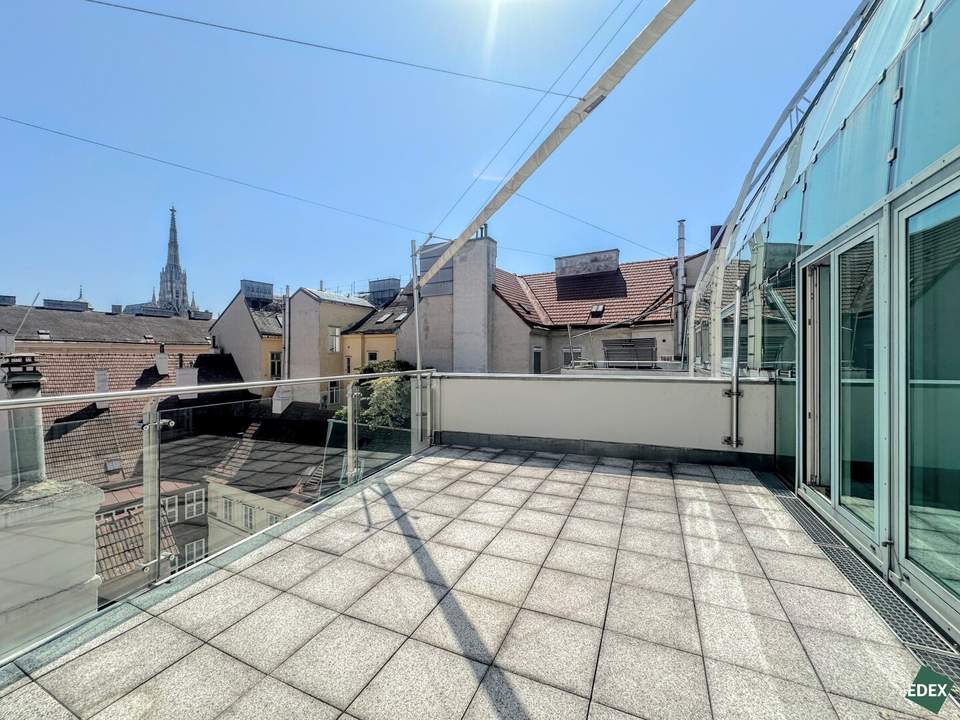 Exclusive Vienna duplex with sun-filled glass front, outdoor areas & St. Stephen’s Cathedral View