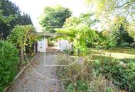 Einfamilienhaus in zentraler Bestlage mit Tennisplatz auf parkähnlichem Grund!