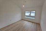 Modernes Plus-Energie-Reihenhaus in Massivholzbauweise