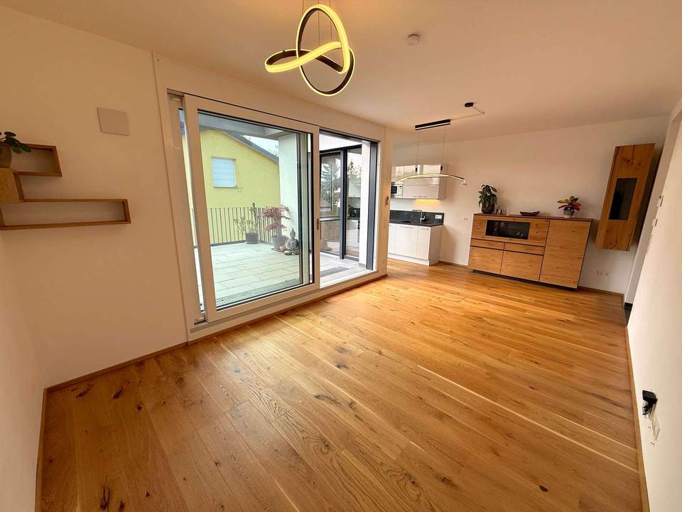 42 m² Außenfläche, kompakt aufgeteilte 56,33 m² Wohnfläche und kleiner Donaublick!