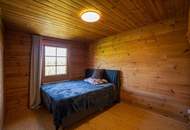 Ein Zuhause zum Wohlfühlen: Großzügiges Holzblockhaus mit Garten und moderner Haustechnik