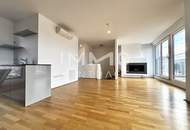 Urbaner Luxus: Maisonette mit Weitblick, Kamin und lichtdurchfluteten Räumen