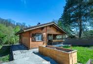 „Wohnen im Einklang mit der Natur – Stilvolles Holzhaus in traumhafter Ruhelage auf unverbaubarem Grundstück“