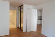 Grüne Oase 500m vom Zentrum – Innenhof mit großem Balkon, Fitness und Co-Working – Erstbezug & Warm