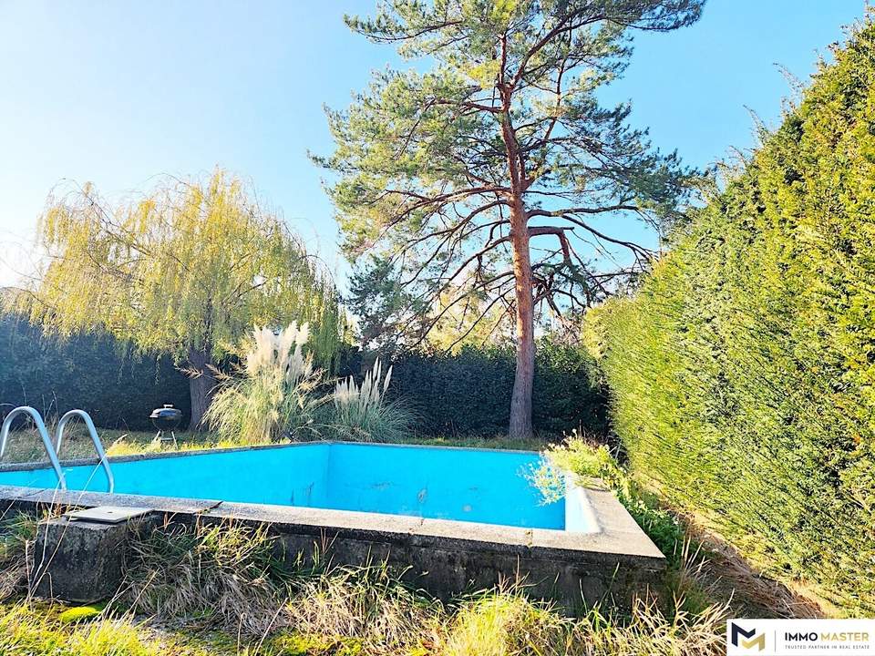 Einfamilienhaus mit großem Grundstück, 2 Eingängen, Grenze zu Wien