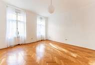 Altbau-Charme mit 3 Zimmern und Süd-Balkon in zentraler Lage