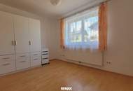 Gartenwohnung mit Reihenhaus-Charakter inklusive Doppelcarport – ruhig & zentral