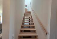 Modernes Plus-Energie-Reihenhaus in Massivholzbauweise