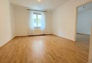 Karmeliterplatz-Charme trifft modernen Komfort – 2-Zimmer-Neubauwohnung mit Stellplatz im Innenhof.