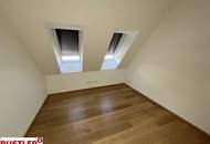 Erstbezugs-Dachgeschosswohnung in zentraler Lage