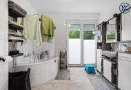 Zuhause im Grünen – Lichtdurchflutete Maisonette mit Gartenoase und Wasserblick