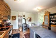 "Kaminfeuer trifft Gartentraum: Topmoderne Gartenwohnung im Wienerwald"