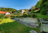 Einfamilienhaus mit Einliegerwohnung, Garage, Carports und Ausblick!