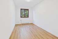 Moderne Erdgeschosswohnung mit Garten, Garage und Blick ins Grüne