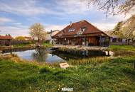 Wohnen am Stausee – Exklusive Villa mit Naturbadeteich