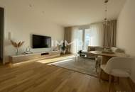Lichtdurchfluteter Erstbezug: 3-Zimmer mit Loggia und Weitblick in top Lage!