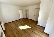 Herrlich sanierte Erdgeschosswohnung mit moderner Wohnküche, stilvollem Badezimmer und Grünblick - in ruhiger Siedlungslage mit ausgezeichneter Infrastruktur, ideal für kleine Familien!