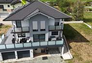 Modernes Einfamilienhaus mit großzügiger Terrasse und Doppelgarage