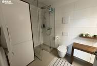 Neuwertige 2-Zimmer-Eigentumswohnung mit Kamin, Loggia und Garage