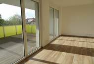Neubauwohnung in Zentrumslage mit großer Balkon-Loggia und Carport