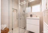 Innenarchitektonisch gestaltete 2-Zimmer-Musterwohnung mit Wohnküche und Terrasse