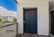 Grenznah wohnen: Moderne Terrassenwohnung für Pendler und Genießer