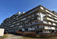 Top vermietete Anlegerwohnung mit Balkon und Tiefgarage - Neuwertig!