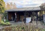 Doppelte Parzelle in Ruhelage: Gepflegter Bungalow mit Wintergarten und Doppelgarage auf einer Doppelparzelle