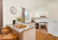 Sonnenverwöhnte Neubauwohnung mit Gartenidylle und Bergblick