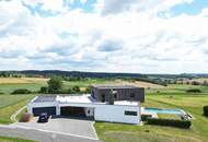 Architektenhaus in sonniger Ruhelage mit Spiral-Weinkeller, Infinity Pool, Burgblick und ca. 1 ha Eigengrund