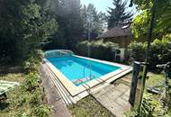 Großzügiges Einfamilienhaus mit Pool, Wintergarten und Doppelgarage mitten im Grünen!