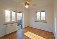 Reizende 3-Zimmer-Wohnung mit 2 Balkonen, gartenseitiger Veranda und Garagenplatz