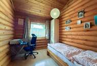 Chalet-Feeling mitten in Donaufeld - Naturstamm-Blockhaus mit Sauna, Kamin und Garten