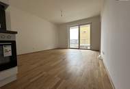 HERRLICHE Neubauwohnung mit Balkon im 1. Obergeschoss – Erstbezug mit exklusiver Ausstattung, Tischlerküche und Tiefgaragenplatz.