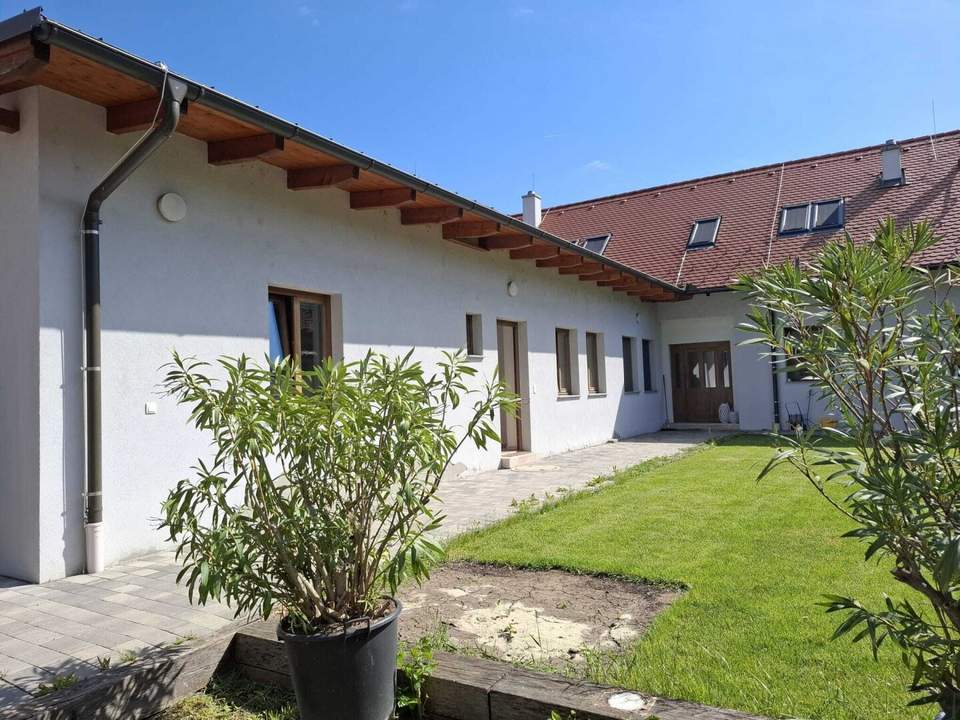 Attraktive, ebenerdige Wohneinheit mit Gartenbenutzung!
