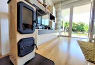 Miete. Neuwertige Wohnung mit Terrasse und Garten in Seeboden. Tiefgarage.