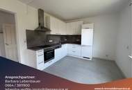 Vermietete Anlegerwohnung mit Balkon und moderner Küche in zentraler Lage