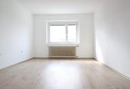 Renovierte-3-Raum-Eigentumswohnung mit Balkon und 203 m² Eigengarten