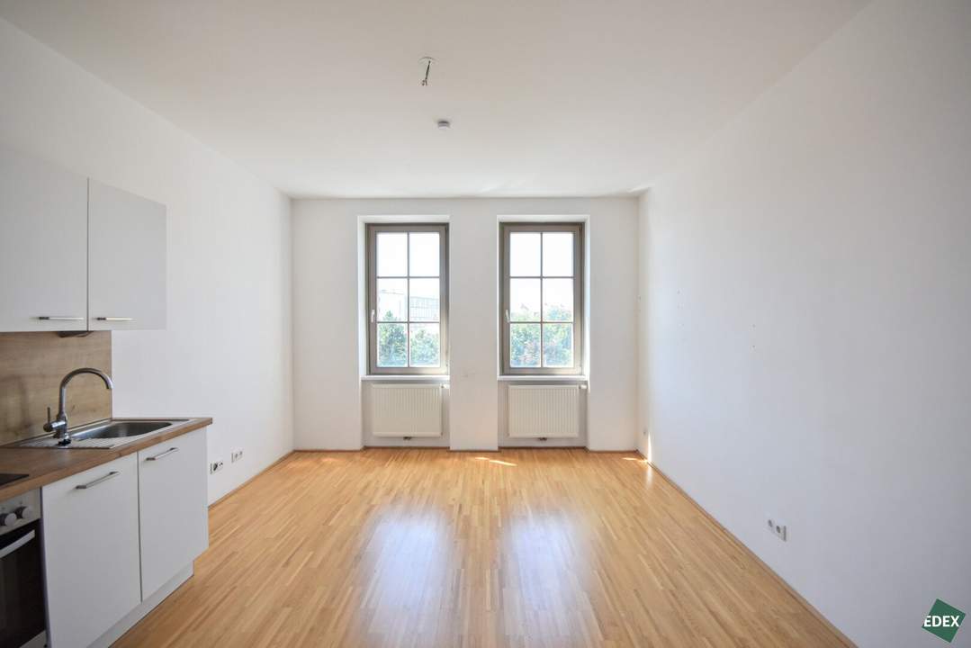 3-Zimmer-Altbau mit hofseitigem Schlafzimmer und Gemeinschaftsterrasse