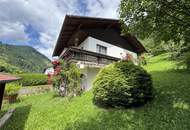 Wohnen mit Weitblick – Großzügiges Einfamilienhaus in Hanglage mit Garten und Bergblick