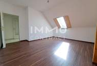 Großzügige Dachwohnung inklusive Eigengarten, Garage und Keller