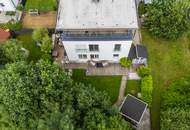 Zuhause im Grünen – Lichtdurchflutete Maisonette mit Gartenoase und Wasserblick
